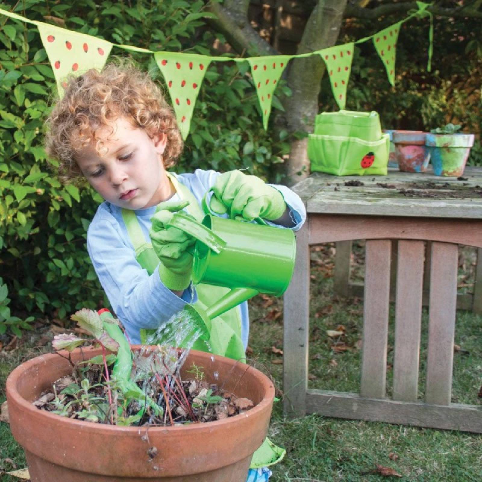 Small Green Bag With Gardening Tools 3+ thumbnails