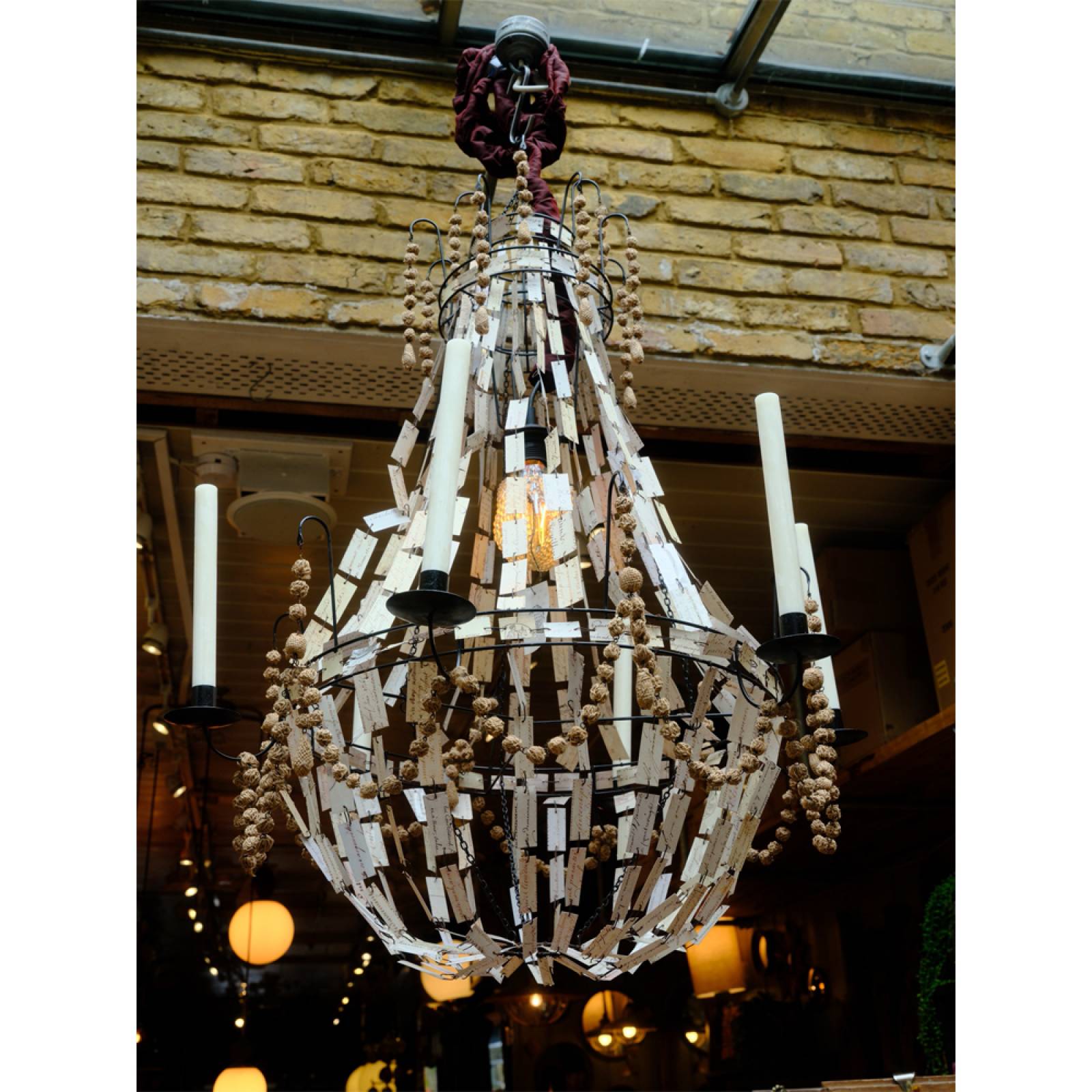 Manuscript Paper and Metal Chandelier Light