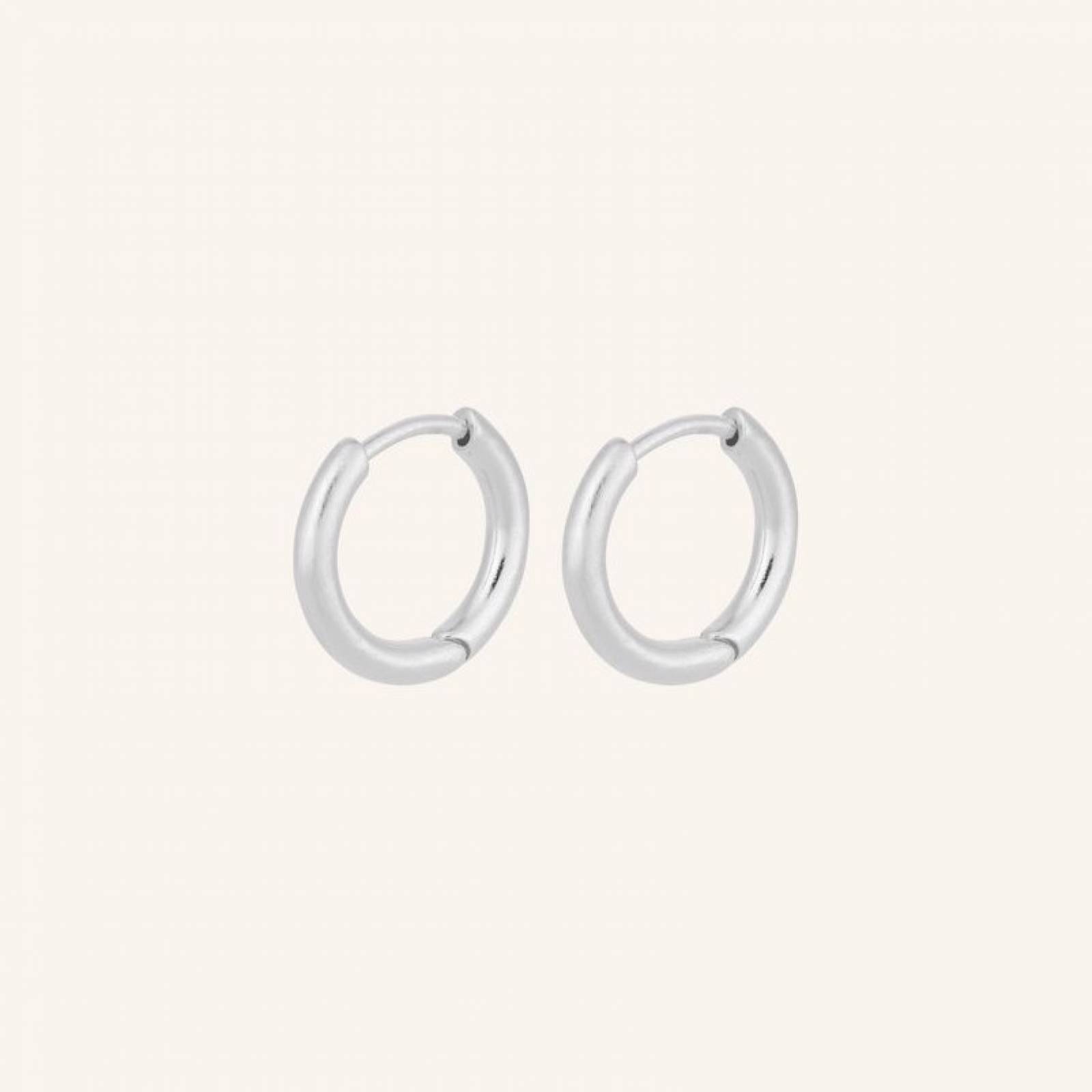 Solid Huggies Hoop Earrings In Silver By Pernillle Corydon