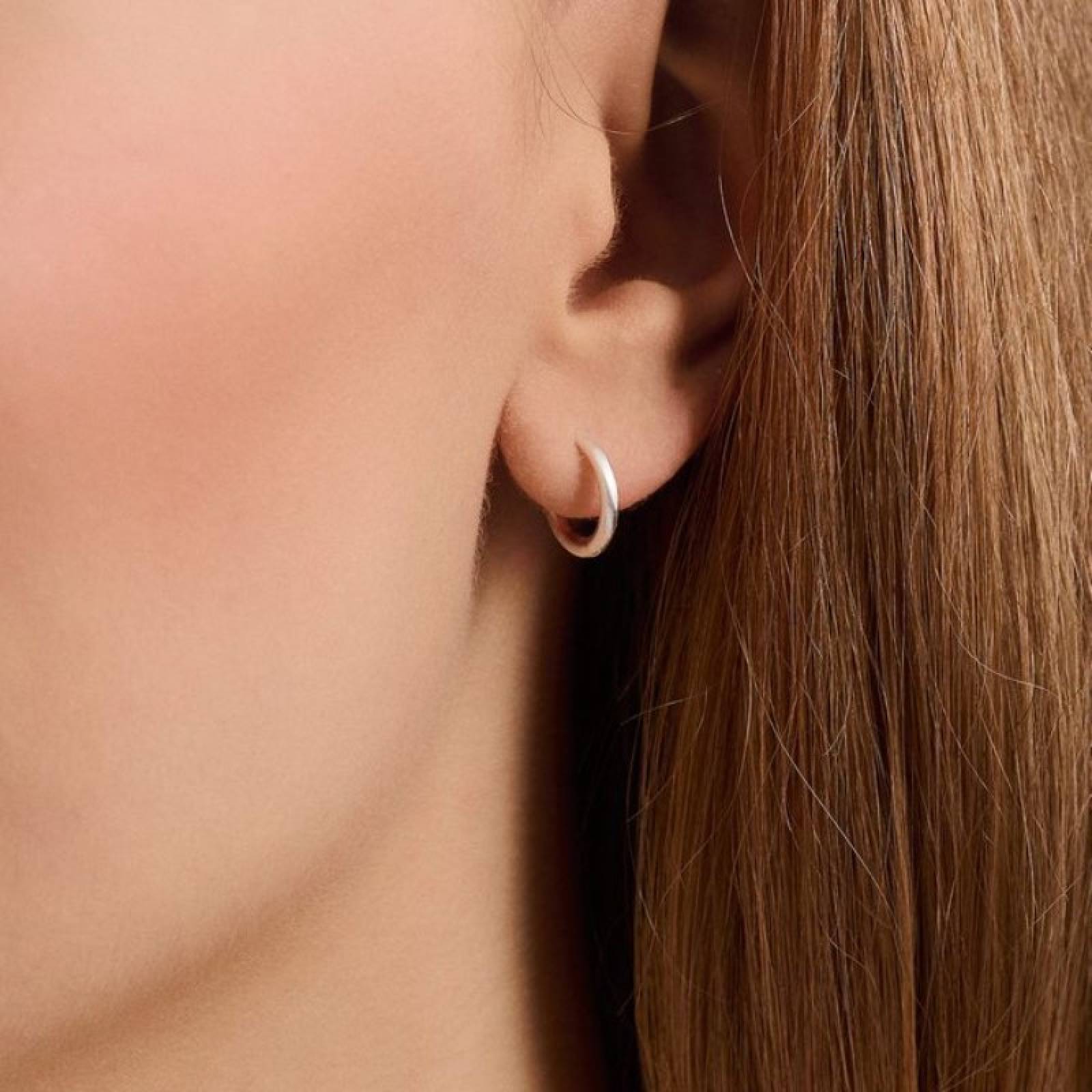 Solid Huggies Hoop Earrings In Silver By Pernillle Corydon thumbnails