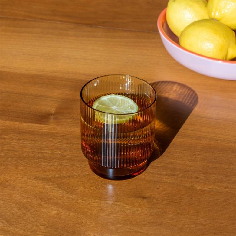 Ribbed Glass Tumbler In Amber