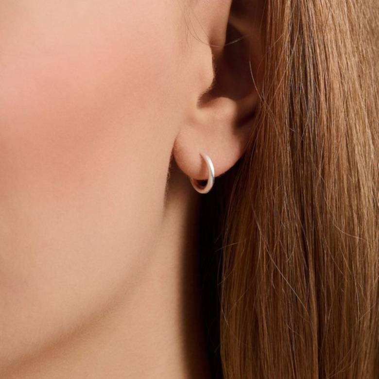 Solid Huggies Hoop Earrings In Silver By Pernillle Corydon